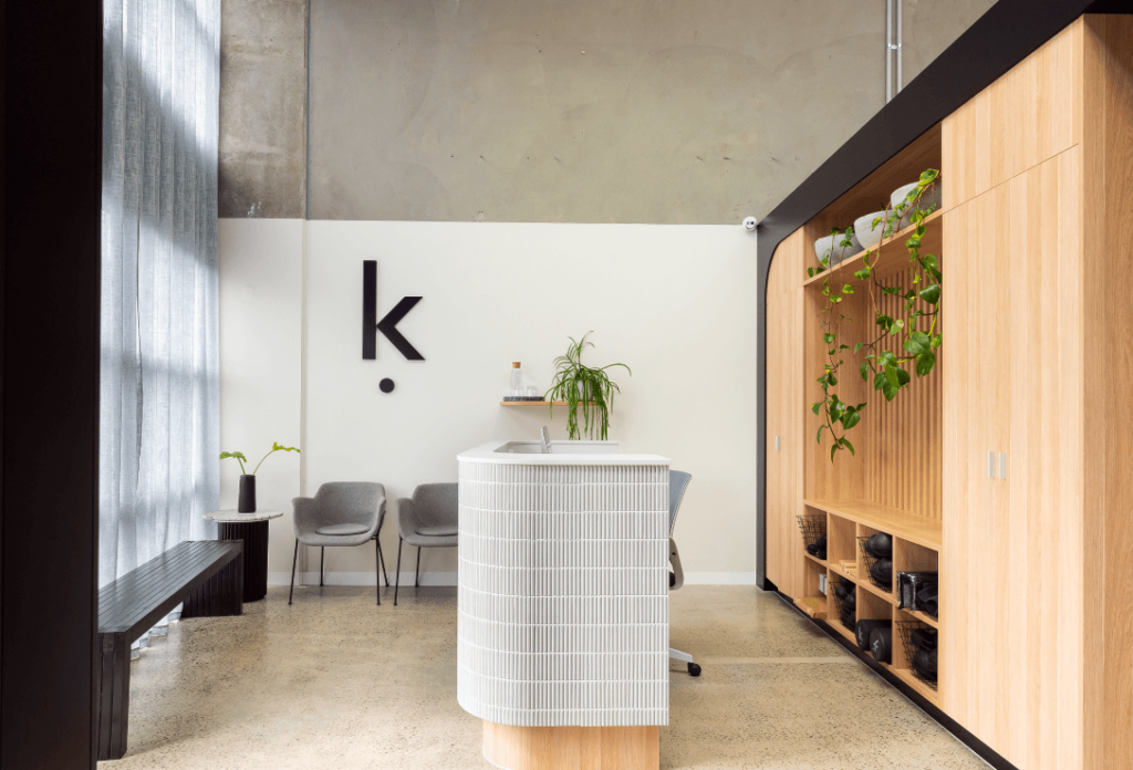 Subway tiling, concrete flooring and black and warm timber colour palette for this fitness fit out for Kinematics