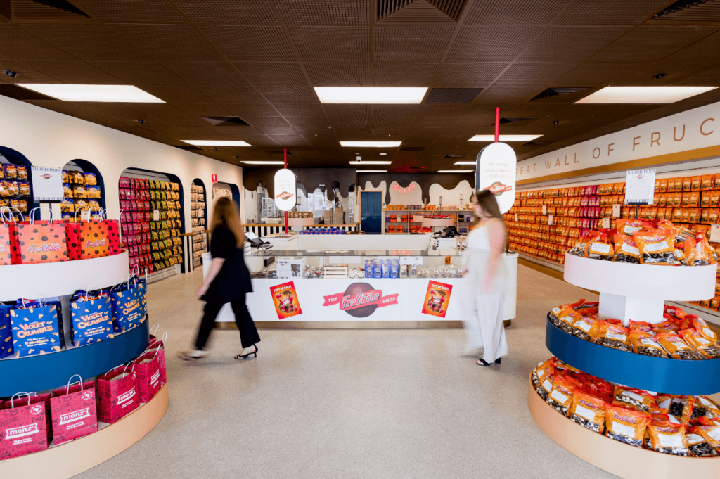 Brown coloured ceiling with drip wall effect, concrete flooring and bespoke product displays for this retail fit out for Fru Choc